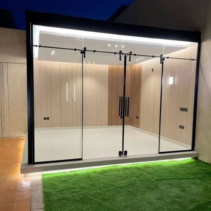 Modern Frameless Sliding Glass Door at Night